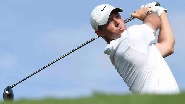 Rory McIlroy watches a tee shot at the 2022 DP World Tour Championship.