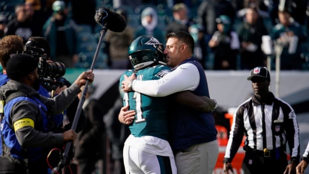 Tennessee Titans head coach Mike Vrabel hugs Philadelphia Eagles wide receiver A.J. Brown (11) as the teams get ready to face off at Lincoln Financial Field Sunday, Dec. 4, 2022, in Philadelphia, Pa.