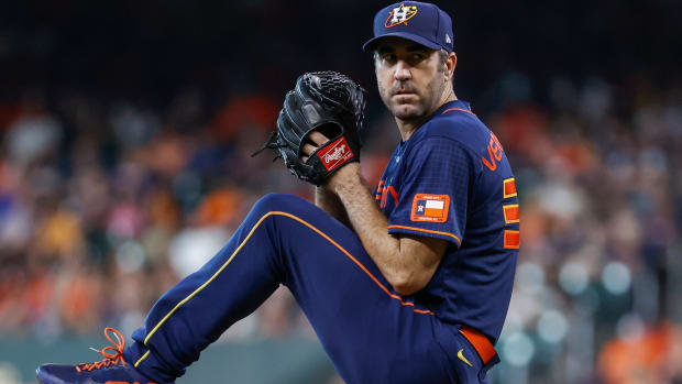 Houston Astros starting pitcher Justin Verlander winds up to pitch in a Space City–themed uniform
