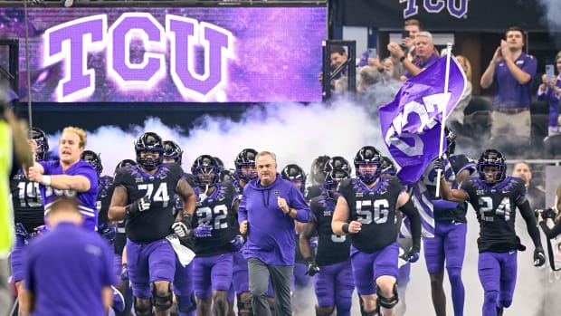 TCU and Sonny Dykes run on to the field