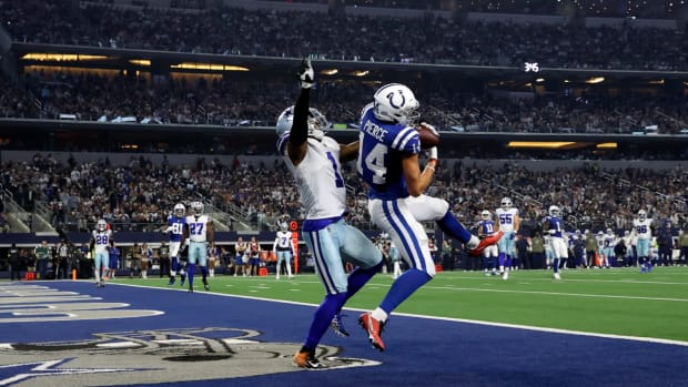 Dec 4, 2022; Arlington, Texas, USA; Indianapolis Colts wide receiver Alec Pierce (14) catches a touchdown pass Dallas Cowboys cornerback Kelvin Joseph (1) defends during the second half at AT&T Stadium.