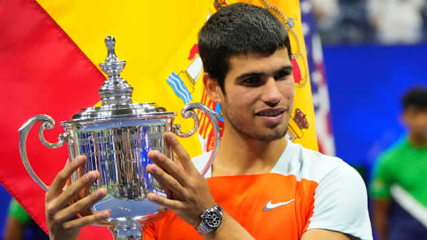 Spanish tennis player Carlos Alcaraz poses with the 2022 U.S. Open trophy.