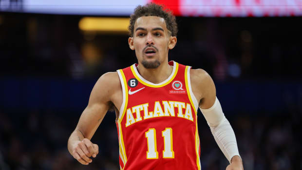 Hawks guard Trae Young (11) reacts after a play during a game against the Magic.