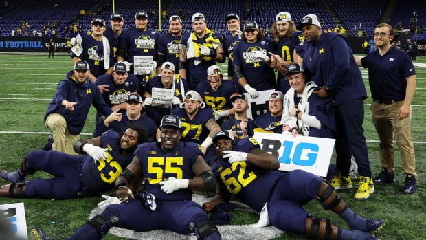 Dec 3, 2022; Indianapolis, Indiana, USA; Michigan Wolverines players pose for a picture following their 43-22 victory against Purdue in the Big Ten Championship at Lucas Oil Stadium.