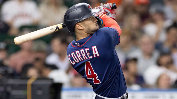 Twins shortstop Carlos Correa bats against the Astros.