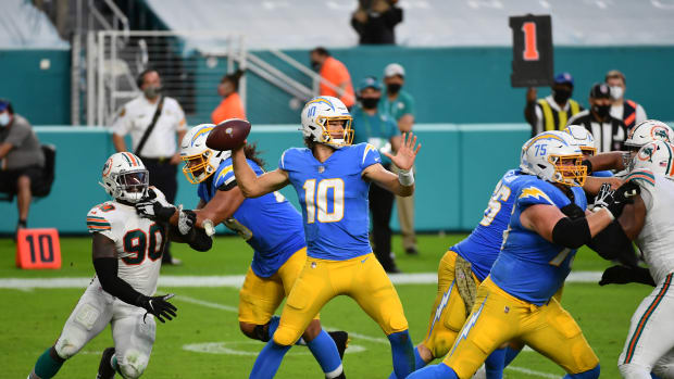 Nov 15, 2020; Miami Gardens, Florida, USA; Los Angeles Chargers quarterback Justin Herbert (10) attempts a pass against the Miami Dolphins during the second half at Hard Rock Stadium. Mandatory Credit: Jasen Vinlove-USA TODAY Sports