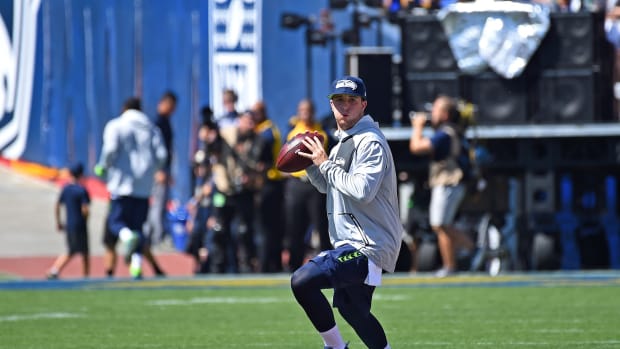 Seattle Seahawks quarterback Jake Heaps (5) warms up before the game against the Los Angeles Rams at the Los Angeles Memorial Coliseum.