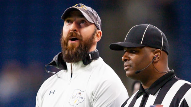 Dec 4, 2021; Detroit, MI, USA; Kent State Golden Flashes head coach Sean Lewis talks to a referee during the second quarter of the MAC Championship Game against the Northern Illinois Huskies at Ford Field. Mandatory Credit: Raj Mehta-USA TODAY Sports