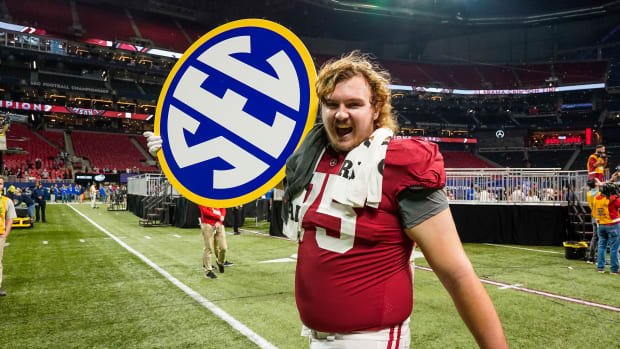 Alabama Crimson Tide offensive lineman Tommy Brown (75) celebrates winning the SEC Championship by defeating the Georgia Bulldogs at Mercedes-Benz Stadium.