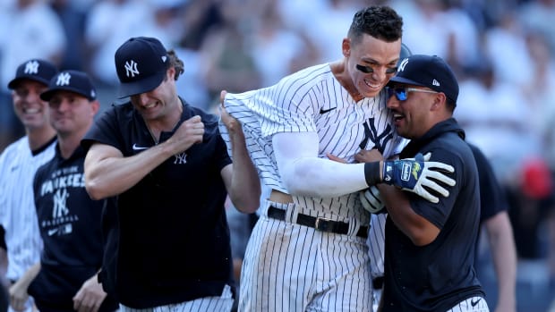 Yankees teammates celebrate with Aaron Judge after a walk-off home run