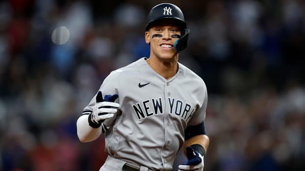New York Yankees right fielder Aaron Judge (99) rounds the bases after hitting home run number sixty-two to break the American League home run record in the first inning against the Texas Rangers at Globe Life Field.