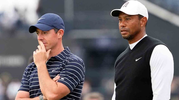 Rory McIlroy and Tiger Woods are pictured at the 2022 British Open.