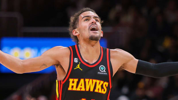 Hawks guard Trae Young reacts to scoring a three-pointer vs. the Thunder.