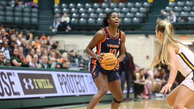 Mir McLean holds the ball during the Virginia women's basketball game against William & Mary at Kaplan Arena.