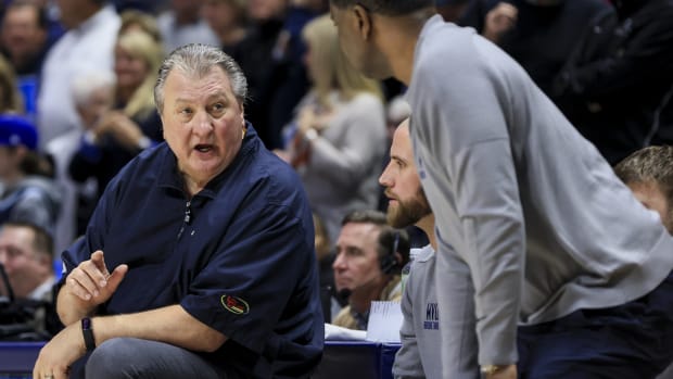 Dec 3, 2022; Cincinnati, Ohio, USA; West Virginia Mountaineers head coach Bob Huggins reacts from the bench in the game against the Xavier Musketeers in the second half at Cintas Center.