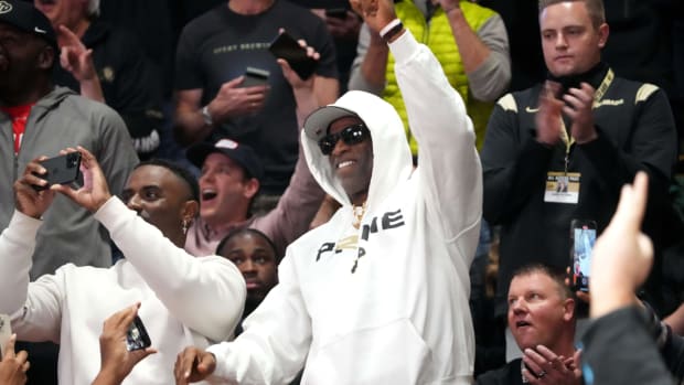 Dec 8, 2022; Boulder, Colorado, USA; Colorado Buffaloes head coach Deion Sanders cheers during the game Colorado State Rams the second half at the CU Events Center. Mandatory Credit: Ron Chenoy-USA TODAY Sports