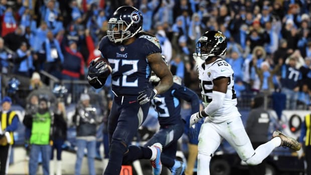 Tennessee Titans running back Derrick Henry (22) is pursued by Jacksonville Jaguars defensive back D.J. Hayden (25) on a 16-yard touchdown run in the third quarter at Nissan Stadium.