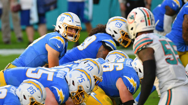 Nov 15, 2020; Miami Gardens, Florida, USA; Los Angeles Chargers quarterback Justin Herbert (10) looks over the offensive line during the first half against the Miami Dolphins at Hard Rock Stadium. Mandatory Credit: Jasen Vinlove-USA