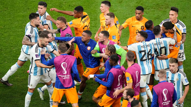 Netherlands and Argentina players argue during the World Cup quarterfinal soccer match.