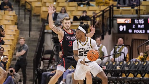 Dec 4, 2022; Columbia, Missouri, USA; Missouri Tigers guard Sean East II (55) dribbles the ball as Southeast Missouri State Redhawks guard Dylan Branson (33) defends during the second half at Mizzou Arena.