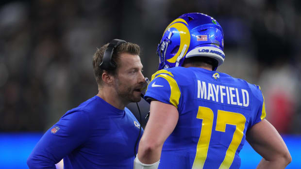 Los Angeles Rams quarterback Baker Mayfield (17) talks with coach Sean McVay in the second half against the Las Vegas Raiders at SoFi Stadium.