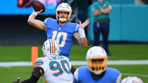 Nov 15, 2020; Miami Gardens, Florida, USA; Los Angeles Chargers quarterback Justin Herbert (10) attempts a pass against the Miami Dolphins during the first half at Hard Rock Stadium. Mandatory Credit: Jasen Vinlove-USA TODAY Sports