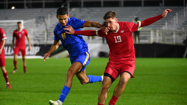 Dec 9, 2022; Cary, NC, USA; Indiana defender Brett Bebej (19) with the ball as Pittsburgh forward Bertin Jacquesson (10) defends in the second half at WakeMed Soccer Park. Mandatory Credit: Bob Donnan-USA TODAY Sports