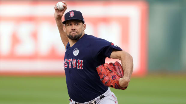 Former Boston Red Sox starting pitcher Nathan Eovaldi winds up to throw a pitch