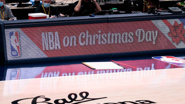 NBA on Christmas Day is displayed across the sideboards on a basketball court