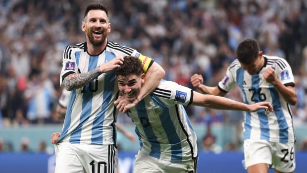 Lionel Messi and Julian Alvarez celebrate an Argentina goal vs. Croatia