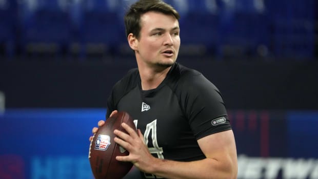 Quarterback Carson Strong drops back to throw a pass while competing at the NFL Scouting Combine.