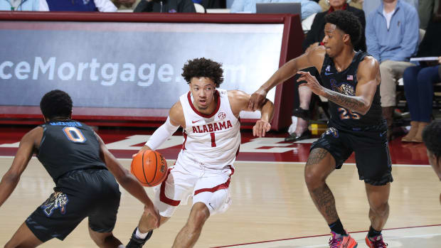 Alabama guard Mark Sears (1) drives past a defender in the Crimson Tide's 91-88 win over the Memphis Tigers on Dec. 13 at Coleman Coliseum in Tuscaloosa, Ala.
