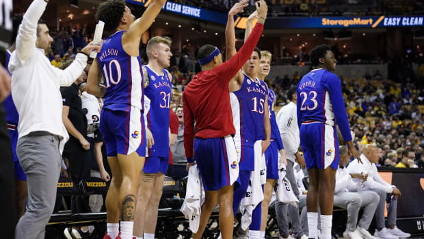 Dec 10, 2022; Columbia, Missouri, USA; Kansas Jayhawks players & coaches celebrate after a score against the Missouri Tigers during the game at Mizzou Arena. Mandatory Credit: Denny Medley-USA TODAY Sports