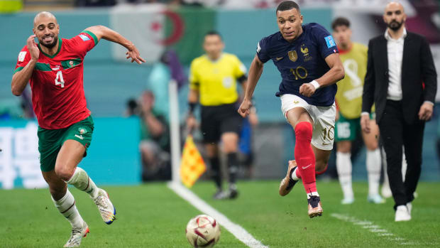 France’s Kylian Mbappé tries to get away from Morocco’s Sofyan Amrabat in the World Cup semifinals.