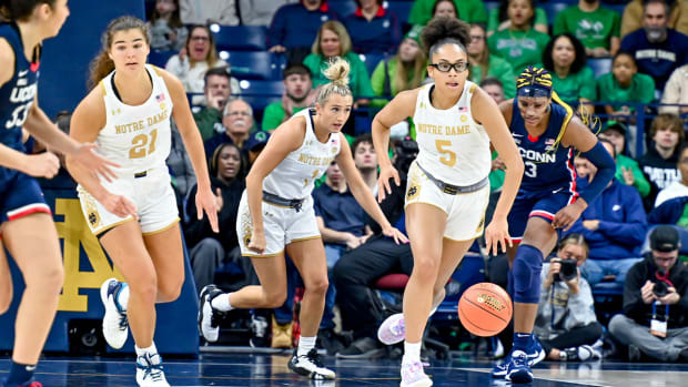 Dec 4, 2022; South Bend, Indiana, USA; Notre Dame Fighting Irish guard Olivia Miles (5) dribbles in the first half against the Connecticut Huskies at the Purcell Pavilion.