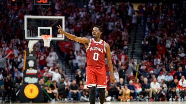 Dec 10, 2022; Las Vegas, Nevada, USA; Indiana Hoosiers guard Xavier Johnson (0) reacts after a three point score against the Arizona Wildcats during the second half at MGM Grand Garden Arena