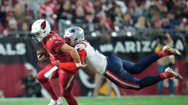 Dec 12, 2022; Glendale, Ariz., USA; Arizona Cardinals quarterback Colt McCoy (12) is sacked by New England Patriots linebacker Matthew Judon (9) during the fourth quarter at State Farm Stadium.