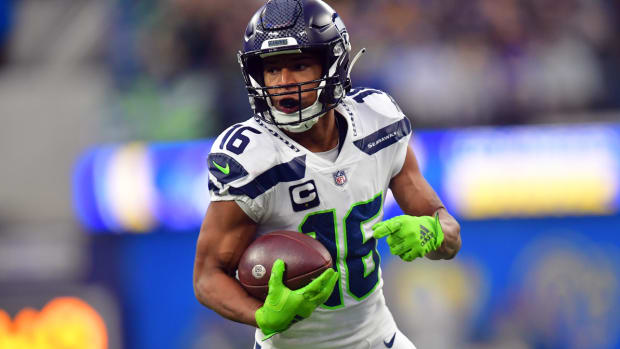 Dec 4, 2022; Inglewood, California, USA; Seattle Seahawks wide receiver Tyler Lockett (16) runs the ball for a touchdown against the Los Angeles Rams during the first half at SoFi Stadium. Mandatory Credit: Gary A. Vasquez-USA TODAY Sports