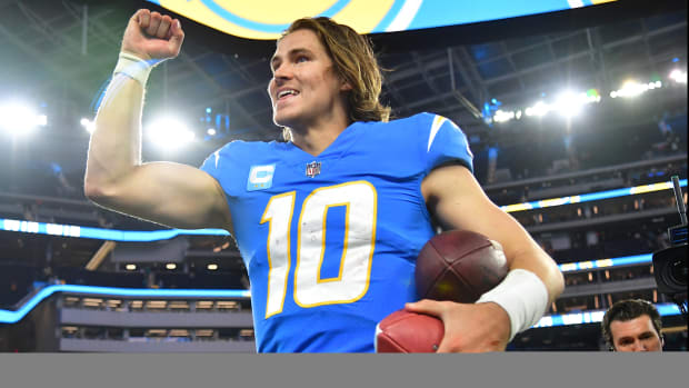 Dec 11, 2022; Inglewood, California, USA; Los Angeles Chargers quarterback Justin Herbert (10) celebrates the victory against the Miami Dolphins at SoFi Stadium. Mandatory Credit: Gary A. Vasquez-USA TODAY Sports