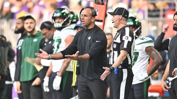 New York Jets head coach Robert Saleh on the sideline with a referee