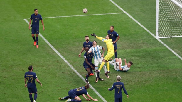 Argentina no.13 Cristian Romero pictured (center) moments before colliding with France goalkeeper Hugo Lloris during the 2022 World Cup final