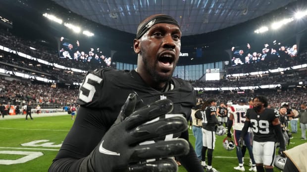 Raiders defensive end Chandler Jones celebrates after scoring on the final play of the game against the Patriots.