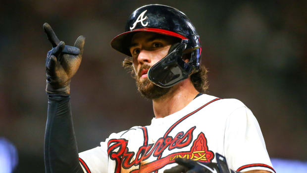 Former Braves shortstop Dansby Swanson celebrates after hitting an RBI single.