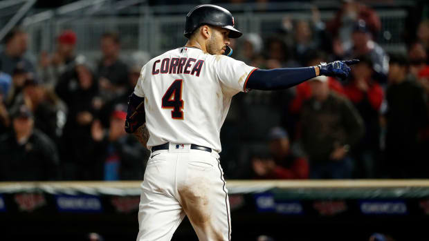 Minnesota Twins shortstop Carlos Correa (4) hits a two run home run against the Cleveland Guardians at Target Field.