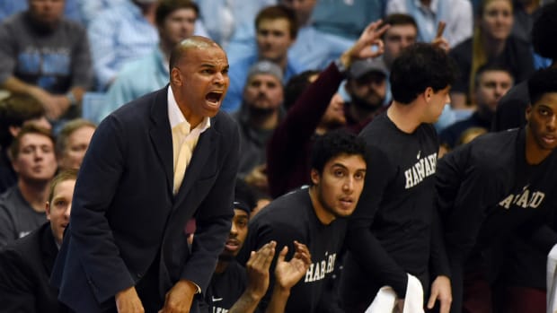 Jan 2, 2019; Chapel Hill, NC, USA; Harvard Crimson head coach Tommy Amaker (left) yells from the sidelines during the first half against the North Carolina Tar Heels at Dean E. Smith Center.