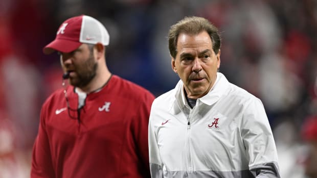 Alabama Crimson Tide head coach Nick Saban runs off the field before playing against the Georgia Bulldogs during the 2022 CFP college football national championship game at Lucas Oil Stadium.