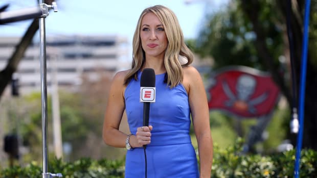 ESPN reporter Jenna Laine is outside One Buc Place as she talking about Tom Brady coming to Tampa Bay Buccaneer at AdventHealth Training Center.