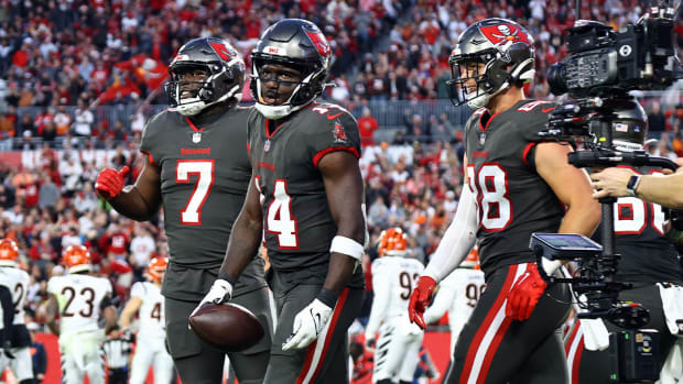 Dec 18, 2022; Tampa, Florida, USA;Tampa Bay Buccaneers wide receiver Chris Godwin (14) celebrates after he scored a touchdown against the Cincinnati Bengals during the second quarter at Raymond James Stadium.