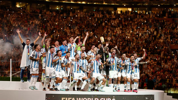 The Argentina team pictured celebrating with their trophy after winning the 2022 FIFA World Cup in Qatar
