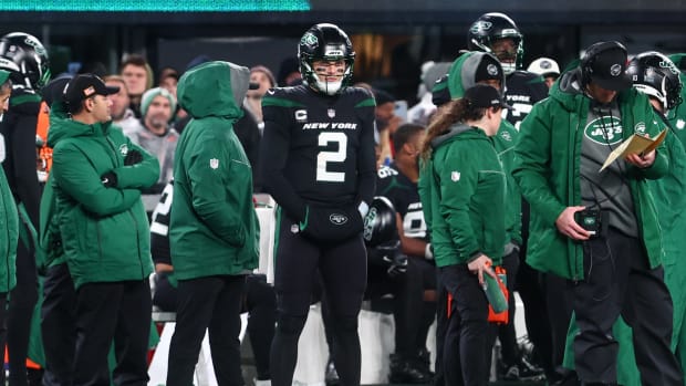 New York Jets QB Zach Wilson standing on sideline after being benched